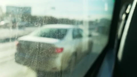 People going to work. They look out the window. Sunny day. Cars driving through  Stock Footage 143379973
