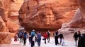 People in gorge that leads to Red Rose City Of Petra in Jordan HD Footage