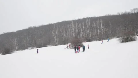 People group sledging sledge winter hill snow local Stock Footage 147559500