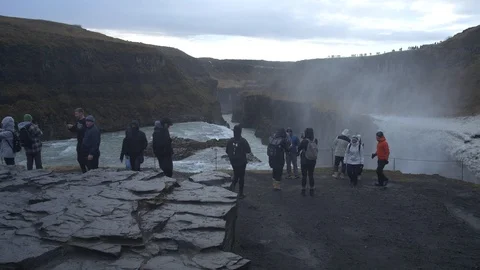 People on Gullfoss waterfall in Iceland Stock Footage