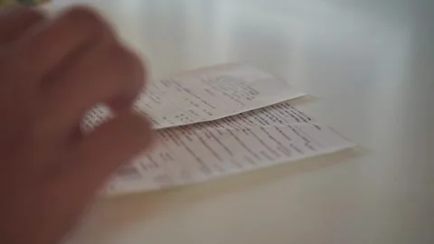 People hand hold and putting money bills with receipt on to table surface, Video stock 344011537