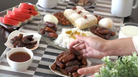 People hand serving and picking dates palm fruit Stock Footage 129326137