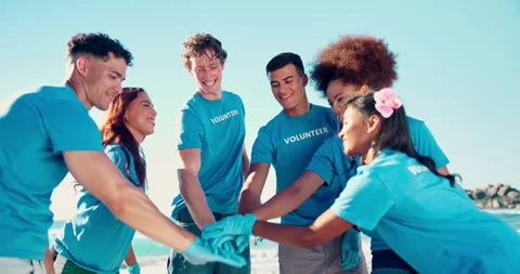 People, hand stack and volunteering on beach of cleaning environment, earth day Stock Footage 294804018