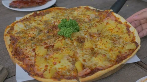 People hand taking slice of pizza  Stock Footage 76989719