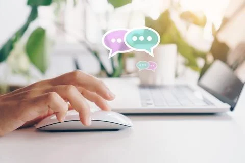 People hand using laptop typing, chatting or text messages in chat icons po.. Stock Photos