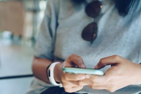 People hand using smartphone to do work business, social network, communica.. Stock Photos