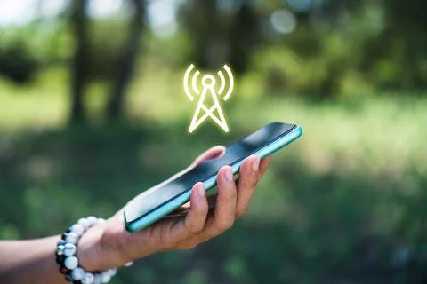People hand using smartphone looking for signal wifi in off the grid no pow.. Stock Photos