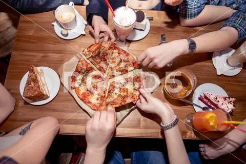 People Hands Taking Slices Of Pizza Margherita. Pizza Margarita and Hands Stock Photos
