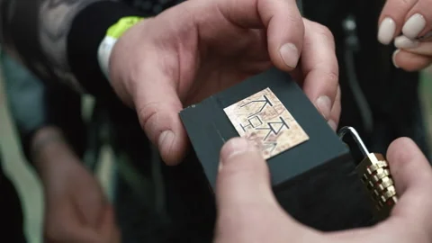 People hands tries to open a small box - a chest with a secret. Logic quest. Stock Footage 199626995
