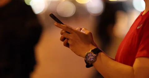 People hands using cellphone at night in Hong Kong city Video stock 148193245