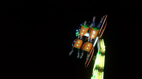 People hanging on a big carousel at night Stock Footage 68760159
