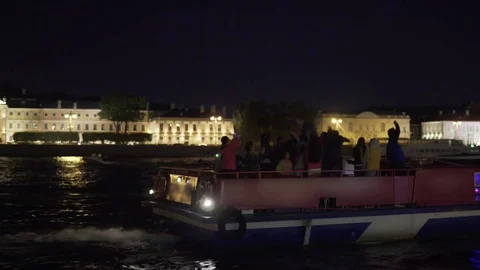 People have fun and dance in the evening on the ship Stock Footage 80096032