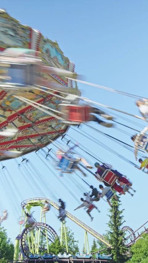 People have fun riding the carousel on a sunny day Video stock 278967650