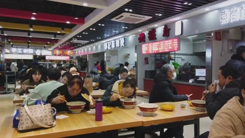 People have lunch after work in food stall, Beijing, China. Stock Footage 156613341
