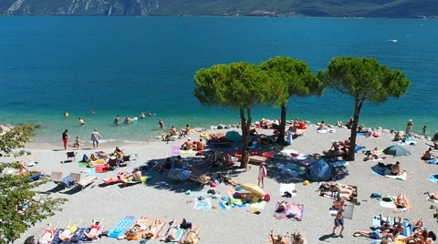 People having bath and fun at Garda Lake Stock Footage 66712903