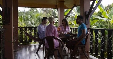 People Having Breakfast Sit At Table Talking On Balcony, Man And Woman Group Stock Footage