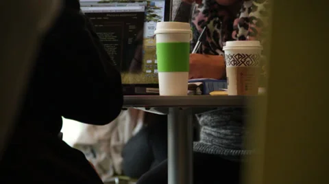 People having coffee while wroking in computer Stock Footage 36174335