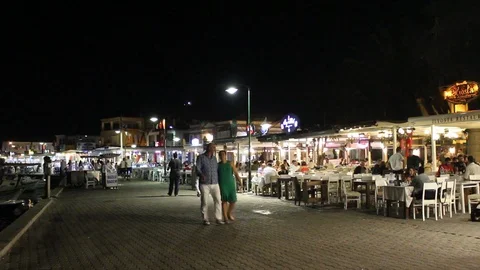People having dinner outside in old town of Cunda (Alibey) island. Stock Footage 87629640