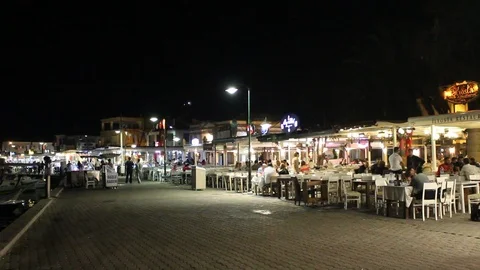 People having dinner outside in old town of Cunda (Alibey) island. Image show Video stock 87630598