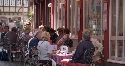 People having a drink in the old town main street of Miltenberg, Germany 4K Stock Footage 119213089