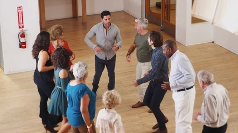 People Having Fun Attending Dance Class In Community Center Stock Footage 111913141