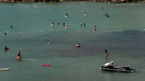 People having fun at the beach and the Aegean sea Stock Footage 69124780