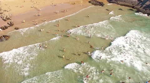People having fun on a beautiful ocean beach aerial view Stock Footage 66580182