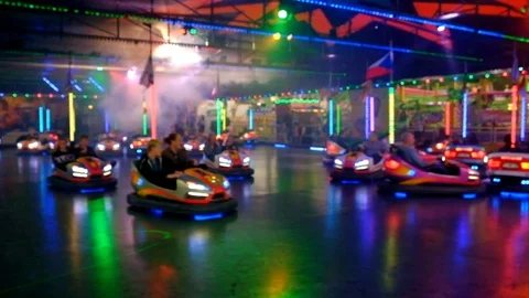 People having fun at bumper car rude during night at funfair in Germany Stock-Footage 95893604