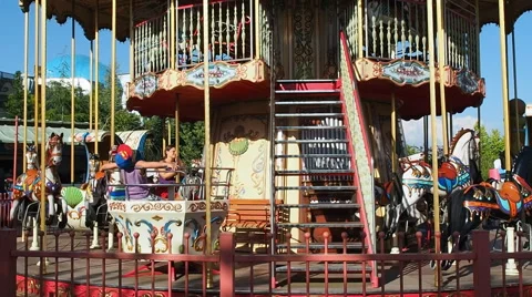 People having fun at Carousel Merry Go Round Stock-Footage 64961848