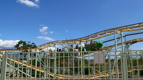 People having fun at childish roller coaster Video stock 79772850