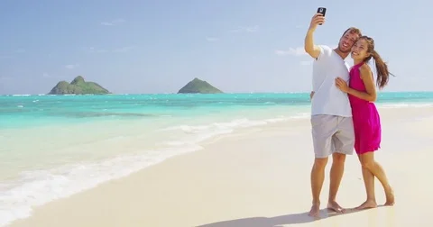 People having fun - couple taking smart phone selfie Stock Footage 85035350