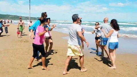 People having fun dancing on the beach Stock Footage 69254852