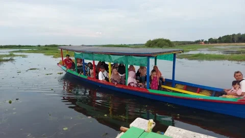 People having fun driving and discovering places with a traditional boat. Video stock 223439843