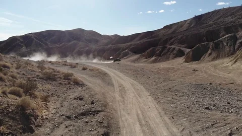 People having fun driving buggy car in the desert mountains Stock Footage 88062535