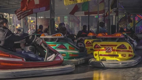 People having fun driving bumper cars at... | Stock Video | Pond5