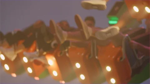 People having fun huge swing ride with lights carnival amusement park Stock Footage 106559965