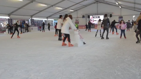 People having fun in ice skating rink Stock Footage 123804412
