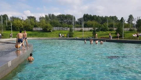 People having fun in pool Stock Photos