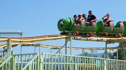 People having fun at roller coaster Stock Footage 64930913