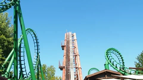People having fun at roller coaster called magic mountain at Gardland Stock Footage 66720416