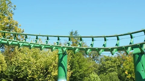 People having fun at roller coaster called magic mountain Stock Footage 70611576