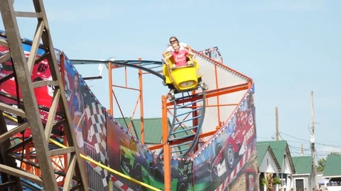 People having fun at roller coaster Stock Footage