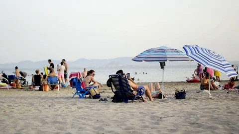 People having fun at the seashore in summer crowded beach, Murcia. 動画素材 117940468