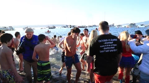 People having fun swimming in cold water, first January Stock Footage 58756322