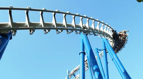 People having fun upside at roller coaster called tornado Stock Footage 66689582
