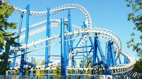 People having fun upside at roller coaster called tornado Stock Footage 66692666