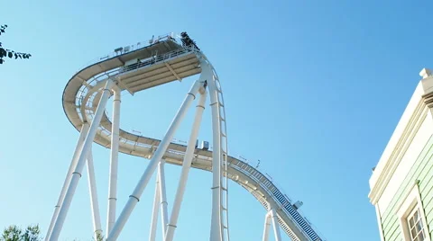 People having fun upside at roller coaster called oblivion at Gardland Stock Footage 66718277