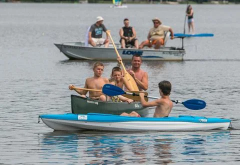 People having fun while boating on a lake. Foto stock