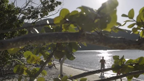 People having good time at beach in st johns virgin island 動画素材 105729537