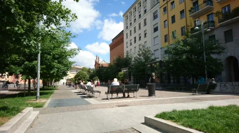 People having lunch break on benches in Milan Stock Footage 63217543